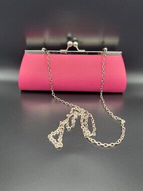 Clutch Purse Fuchsia faux leather featuring a silver kiss-lock clasp